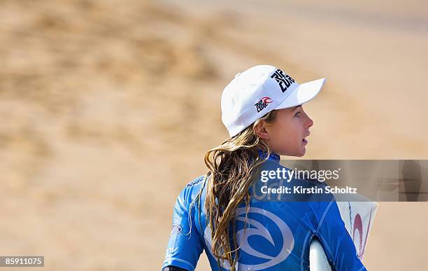 Rip Curl Pro wildcard surfer Nikki Van Dijk of Australia, aged 14, walks up the beach after her Round 3 heat at the Rip Curl Pro on April 11, 2009 in...