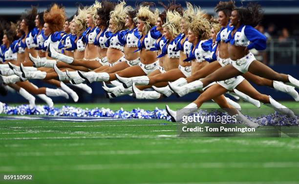 The Dallas Cowboys Cheerleaders perform before the Dallas Cowboys take on the Green Bay Packers at AT&T Stadium on October 8, 2017 in Arlington,...