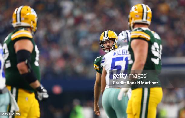 Mason Crosby of the Green Bay Packers reacts after missing his second extra point attempt in the second quarter against the Dallas Cowboys at AT&T...