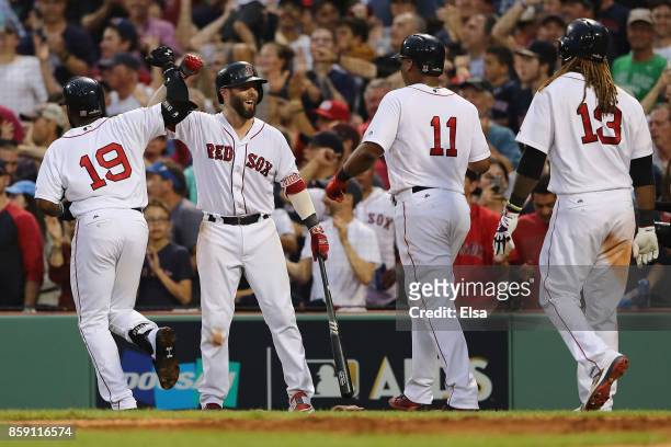 Dustin Pedroia of the Boston Red Sox celebrates after Jackie Bradley Jr. #19 hit a three-run home run in the seventh inning against the Houston...