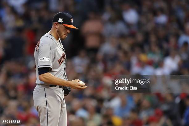 Joe Musgrove of the Houston Astros reacts after a three-run home run by Jackie Bradley Jr. #19 of the Boston Red Sox in the seventh inning during...