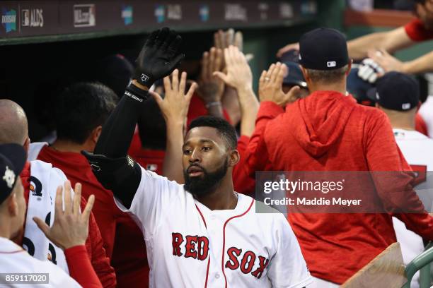 Jackie Bradley Jr. #19 of the Boston Red Sox celebrates in the dugout after hitting a three-run home run in the seventh inning against the Houston...