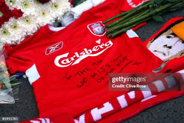 Liverpool shirt is laid in tribute at the Liverpool memorial for those who died in the Hillsborough disaster prior to the Barclays Premier League...