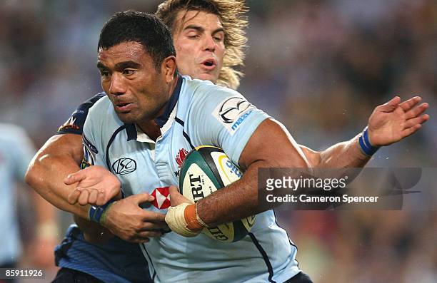 Wycliff Palu of the Waratahs is tackled during the round nine Super 14 match between the Waratahs and the Bulls at the Sydney Football Stadium on...