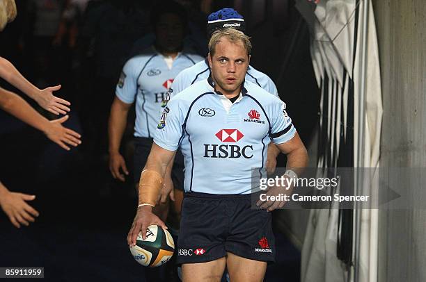 Waratahs captain Phil Waugh leads his team out for the round nine Super 14 match between the Waratahs and the Bulls at the Sydney Football Stadium on...