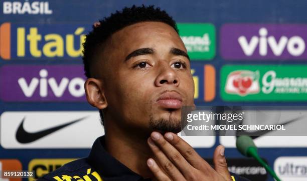 Brazil's Gabriel Jesus gestures during a press conference at the Palmeiras training center, in Sao Paulo, Brazil, on October 8, 2017 ahead of their...