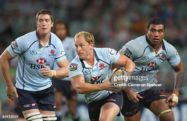 Brett Sheehan of the Waratahs runs the ball during the round nine Super 14 match between the Waratahs and the Bulls at the Sydney Football Stadium on...