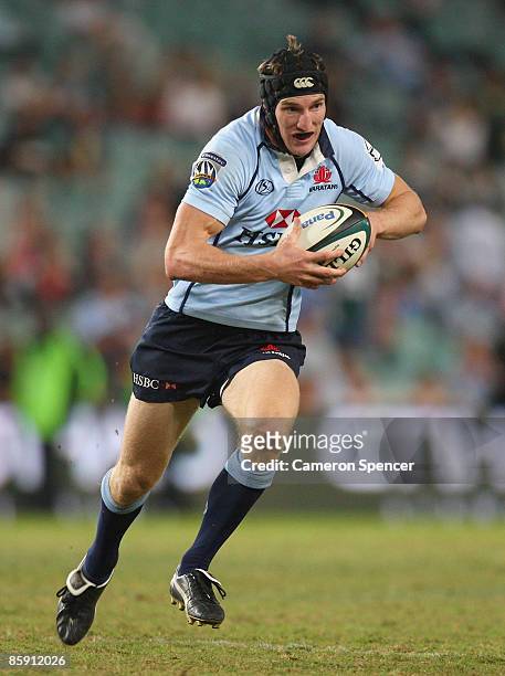 Sam Norton-Knight of the Waratahs runs the ball during the round nine Super 14 match between the Waratahs and the Bulls at the Sydney Football...