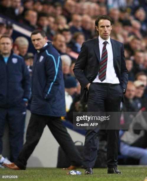 Middlesbrough manager Gareth Southgate and West Bromwich Albion manager Tony Mowbray watch the Premier League football match between West Bromwich...