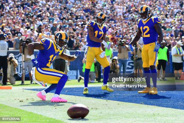 Tavon Austin, Sammy Watkins and Robert Woods of the Los Angeles Rams celebrate after scoring a touchdown during the game against the Seattle Seahawks...