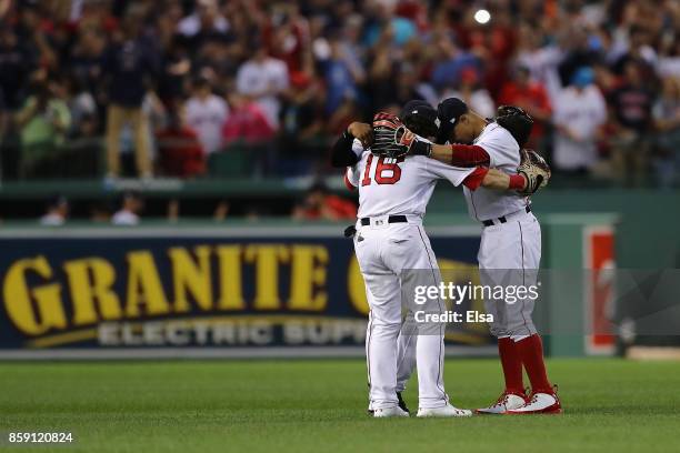 Jackie Bradley Jr. #19, Andrew Benintendi and Mookie Betts of the Boston Red Sox celebrate defeating the Houston Astros 10-3 in game three of the...