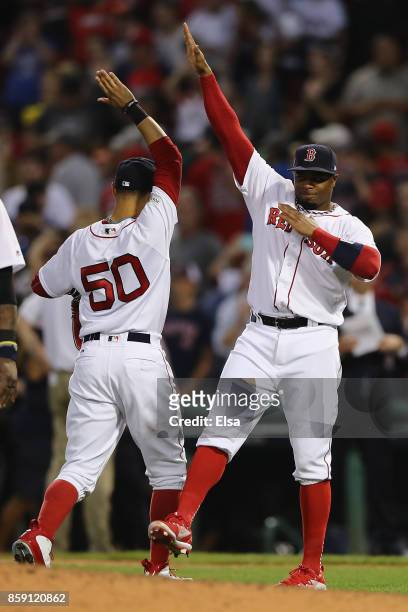 Rajai Davis of the Boston Red Sox celebrates with Mookie Betts after defeating the Houston Astros 10-3 in game three of the American League Division...