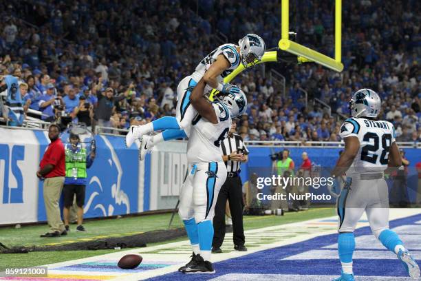 Carolina Panthers running back Christian McCaffrey celebrates with offensive tackle Daryl Williams after scoring a touchdown during the first half of...