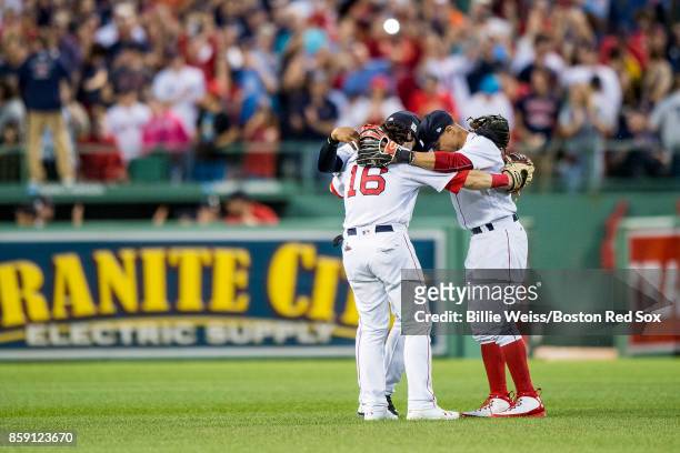 Mookie Betts, Jackie Bradley Jr. #19, and Andrew Benintendi of the Boston Red Sox celebrate a victory in game three of the American League Division...