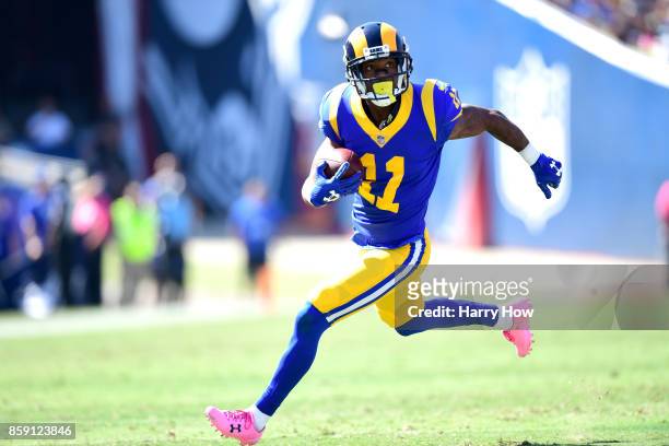 Tavon Austin of the Los Angeles Rams runs with the ball to make a touchdown during the game against the Seattle Seahawks at the Los Angeles Memorial...