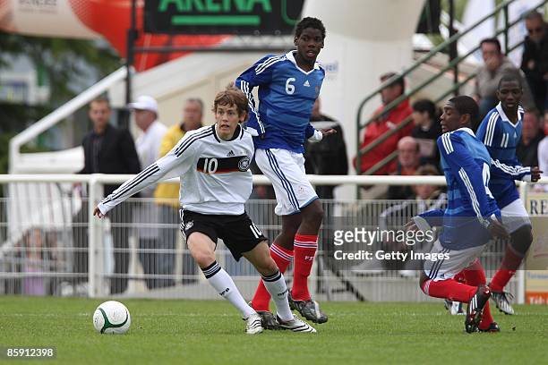 Fabian Hurzeler of Germany and Paul Pogba of France battle for the ball during the U16 international friendly match between France and Germany at the...