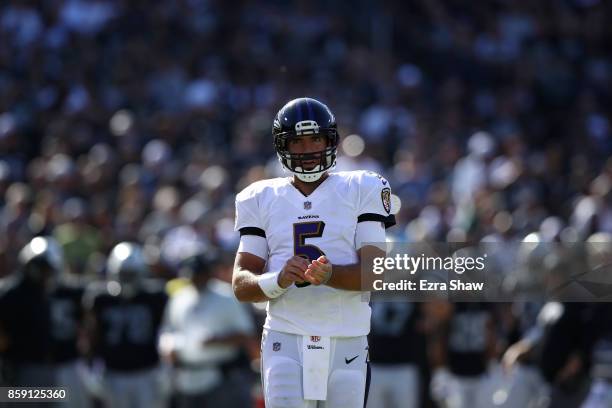 Joe Flacco of the Baltimore Ravens looks on during their NFL game against the Oakland Raiders at Oakland-Alameda County Coliseum on October 8, 2017...