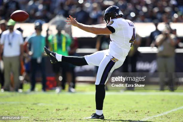 Sam Koch of the Baltimore Ravens punts the ball against the Oakland Raiders during their NFL game at Oakland-Alameda County Coliseum on October 8,...