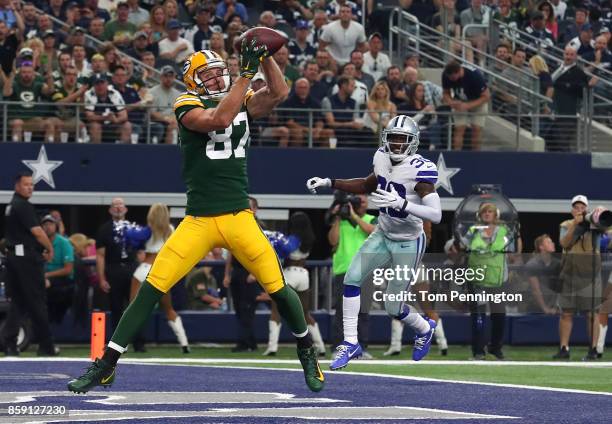 Jordy Nelson of the Green Bay Packers goes up for a touchdown pass against the Dallas Cowboys in the third quarter of a football game at AT&T Stadium...