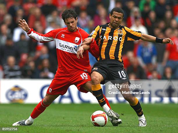 Jeremie Aliadiere of Middlesbrough and Geovanni Gomez of Hull challenge for the ball during the Barclays Premier League match between Middlesbrough...