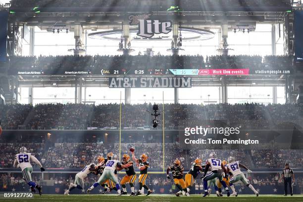 Aaron Rodgers of the Green Bay Packers looks for an open receiver in the third quarter against the Dallas Cowboys at AT&T Stadium on October 8, 2017...