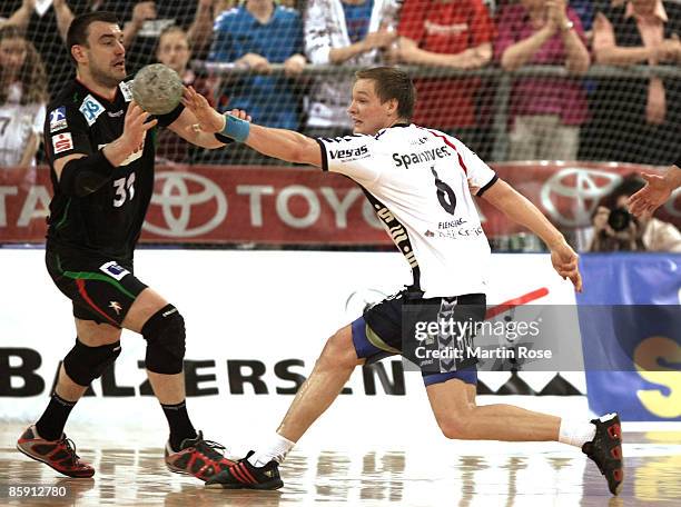 Oscar Carlen of Flensburg and Bartosz Jurecki of Magdeburg in action during the Bundesliga game between SG Flensburg-Handewitt and SG Magdeburg at...