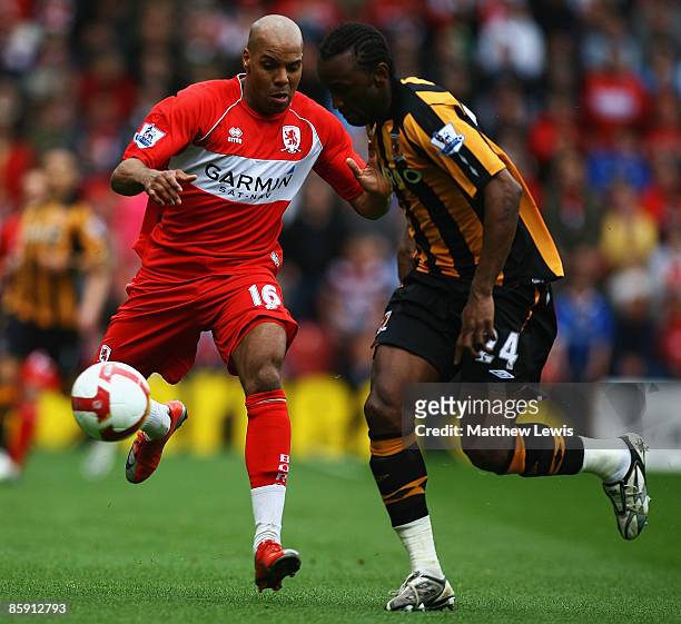Marlon King of Middlesbrough and Kamil Zayatte of Hull challenge for the ball during the Barclays Premier League match between Middlesbrough and Hull...