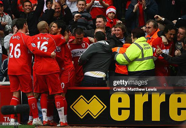 Tuncay Sali of Middlesbrough celebrates his goal with fans during the Barclays Premier League match between Middlesbrough and Hull City at the...