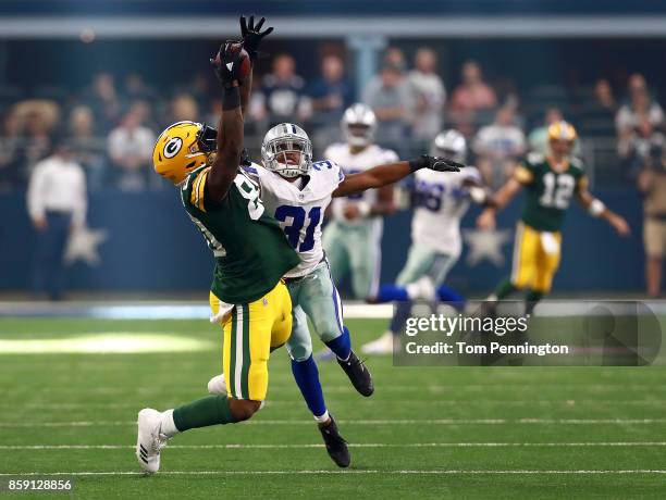 Martellus Bennett of the Green Bay Packers catches a pass as Byron Jones of the Dallas Cowboys defends in the third quarter of a football game at...