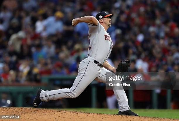 Luke Gregerson of the Houston Astros throws a pitch in the eighth inning against the Boston Red Sox during game three of the American League Division...