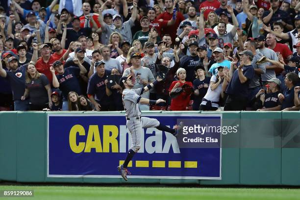 Josh Reddick of the Houston Astros is unable to catch a three-run home run ball hit by Jackie Bradley Jr. #19 of the Boston Red Sox in the seventh...