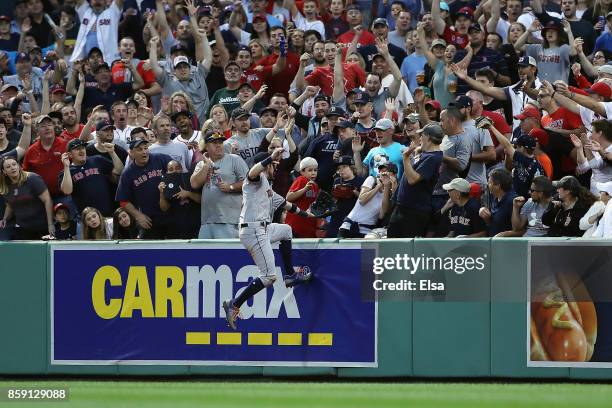 Josh Reddick of the Houston Astros is unable to catch a three-run home run ball hit by Jackie Bradley Jr. #19 of the Boston Red Sox in the seventh...