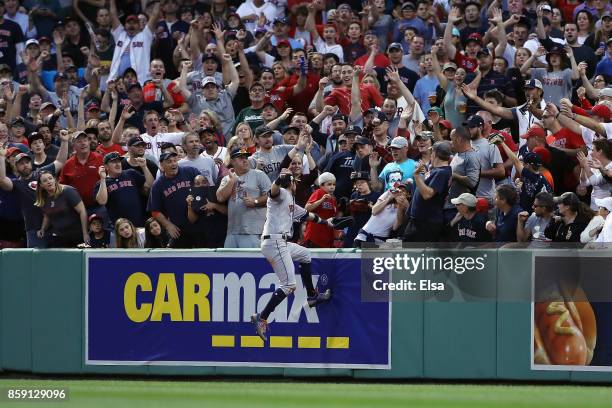 Josh Reddick of the Houston Astros is unable to catch a three-run home run ball hit by Jackie Bradley Jr. #19 of the Boston Red Sox in the seventh...