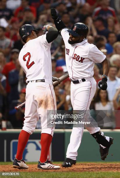 Jackie Bradley Jr. #19 of the Boston Red Sox celebrates with Xander Bogaerts after hitting a three-run home run in the seventh inning against the...