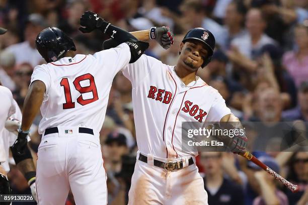 Jackie Bradley Jr. #19 of the Boston Red Sox celebrates with Xander Bogaerts after hitting a three-run home run in the seventh inning against the...