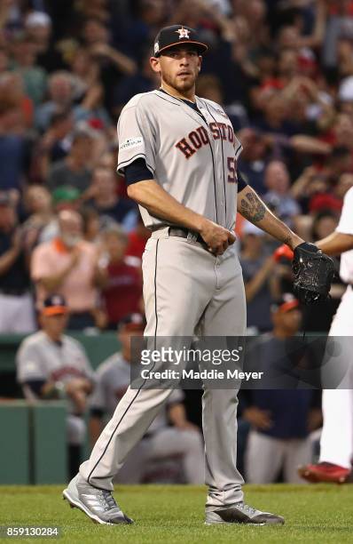 Joe Musgrove of the Houston Astros reacts after a three-run home run by Jackie Bradley Jr. #19 of the Boston Red Sox in the seventh inning during...