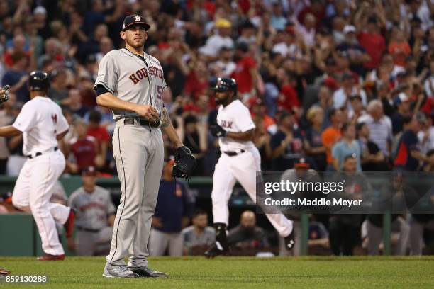 Joe Musgrove of the Houston Astros reacts after a three-run home run by Jackie Bradley Jr. #19 of the Boston Red Sox in the seventh inning during...