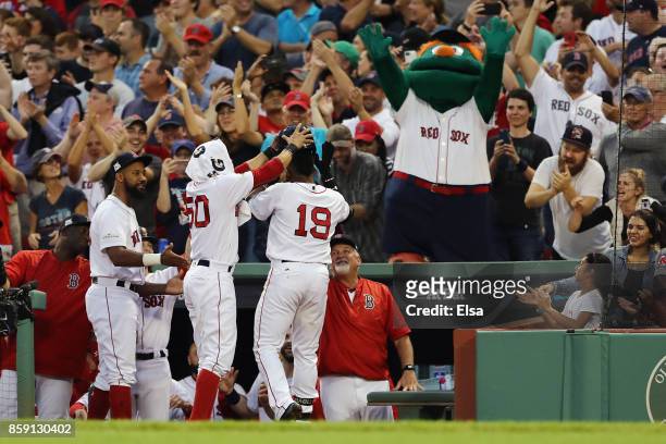 Jackie Bradley Jr. #19 of the Boston Red Sox celebrates with teammates at the dugout after hitting a three-run home run in the seventh inning against...