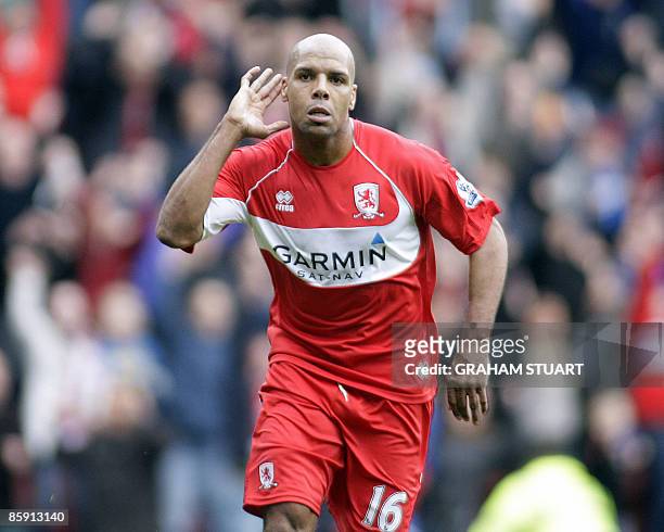 Middlesbrough's Jamaican striker Marlon King celebrates scoring their 3rd goal during the English FA Premier League football match against Hull CIty...