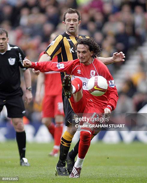 Middlesbrough's turkish player Tuncay Sanil vies with Hull City's Ian Ashbee during the English FA Premier League football match against Hull CIty at...