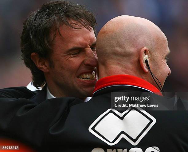 Gareth Southgate, manager of Middlesbrough celebrates his teams third goal with a member of his coaching staff during the Barclays Premier League...