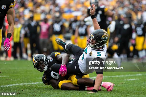 Jacksonville Jaguars quarterback Blake Bortles is taken to the ground after throwing a pass attempt by Pittsburgh Steelers inside linebacker Vince...