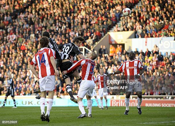 Newcastle United's English striker Andy Carroll scores his side's equalizing goal in the English Premier League football match between Stoke City and...