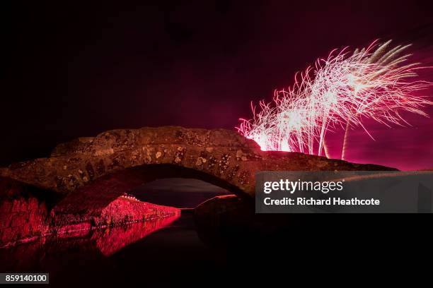 Fireworks explode behind the Swilken Bridge as part of the Dunhill Links celebrations at The Old Course on October 07, 2017 in St Andrews, Scotland.