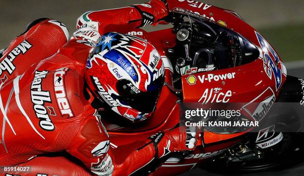 MotoGP rider Casey Stoner of Australia races during the 2009 MotoGP free practice at Losail International Circuit near Doha on April 11, 2009....