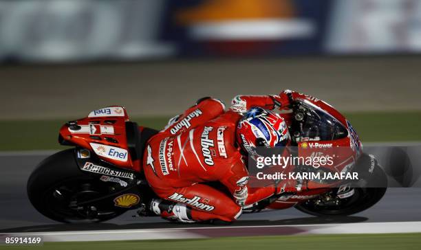 MotoGP rider Casey Stoner of Australia races during the 2009 MotoGP free practice at Losail International Circuit near Doha on April 11, 2009....