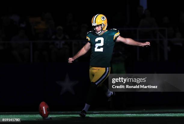 Mason Crosby of the Green Bay Packers kicks off to the Dallas Cowboys in the fourth quarter at AT&T Stadium on October 8, 2017 in Arlington, Texas.