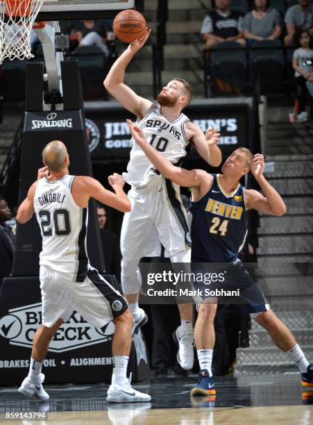 Matt Costello of the San Antonio Spurs shoots the ball against the Denver Nuggets during the preseason game on October 8, 2017 at the AT&T Center in...