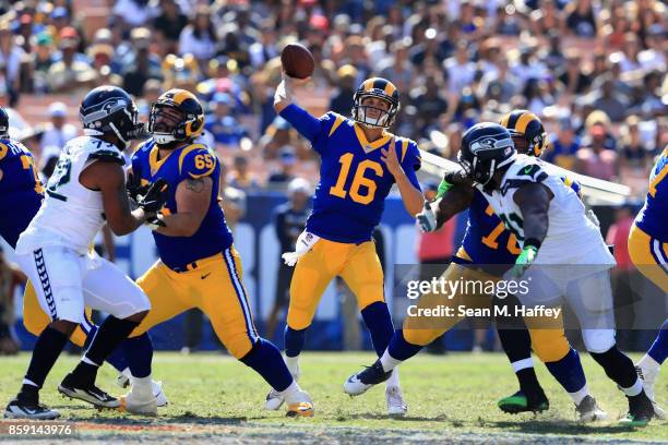 John Sullivan of the Los Angeles Rams blocks as Jared Goff of the Los Angeles Rams passes the ball during the second half of a game against the...
