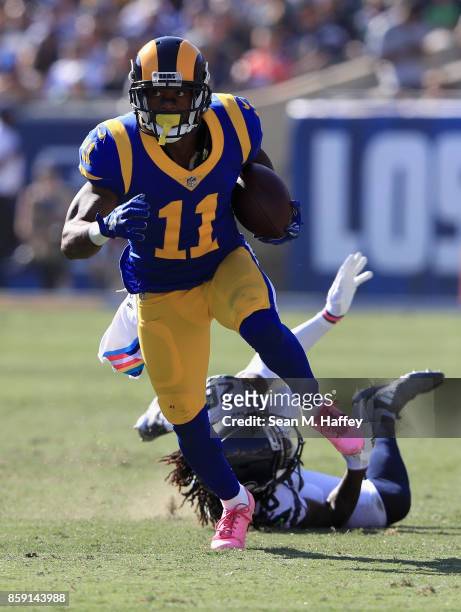 Tavon Austin of the Los Angeles Rams eludes Shaquill Griffin of the Seattle Seahawks during the second half of a game at Los Angeles Memorial...